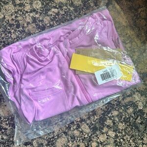 NWT sleeveless zippered bubble gum romper. Purchased two by accident.